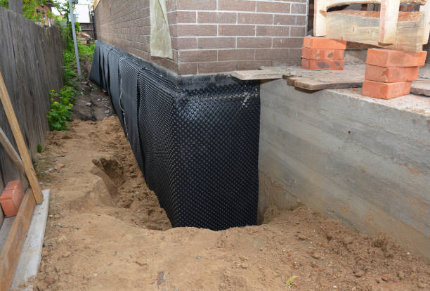 SJ Waterproofing Pros technician performing targeted Vapor Barrier Installation assessment in Leopolis, WI